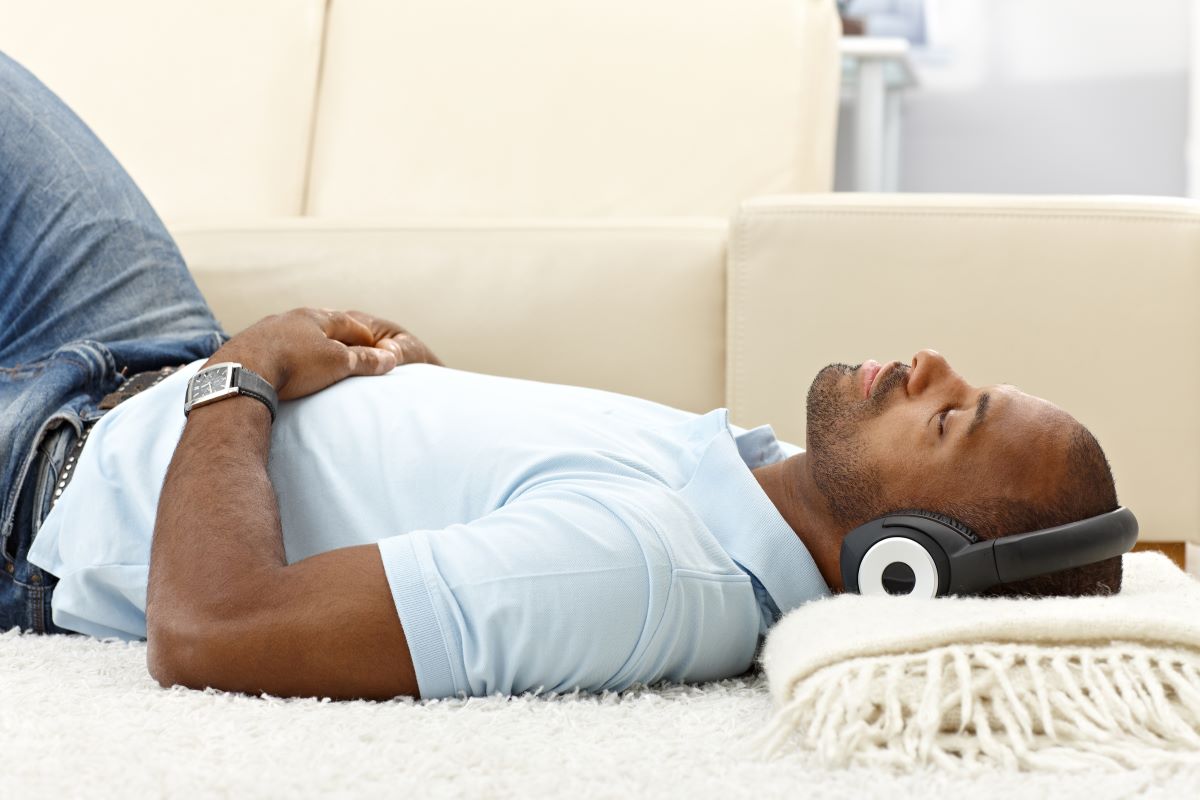 A man relaxing and listening to music